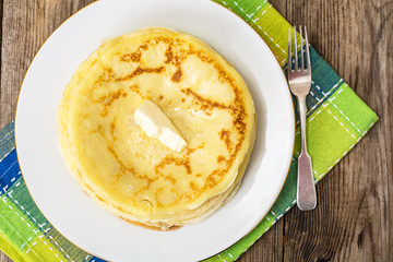 Thin pancakes with butter