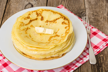Thin pancakes with butter