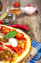 Rustic Italian Pizza on a Thin Pastry with Minced Pork, Ham, Tom