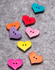 Fototapeta premium Wooden hearts on gray felt background, copy space