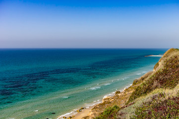 Fototapeta na wymiar The sea from a height, wave, beach slope.