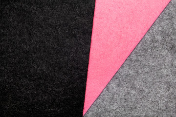 Colorful felt texture for background with copys pace. Black, gray and pink color composition