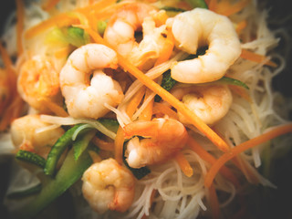 Rice noodles with shrimps, zucchini and carrot