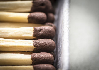 The heads of wooden matches close-up.