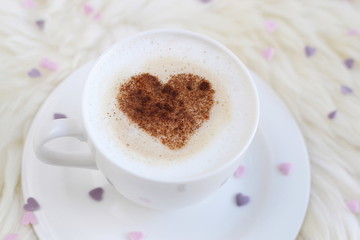 Cappuccino with heart pattern of cinnamon