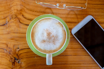 Coffee on wood table.