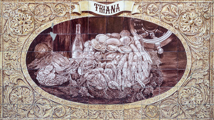Tiled mural from Triana area, Seville, Andalucia, Spain. Mural depicting seafood