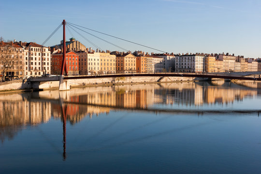 Lyon skyline with footbridge over the Saone river and waterfront buildings France Europe