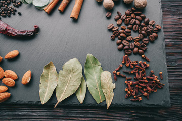 nuts, spices and food on a wooden tray