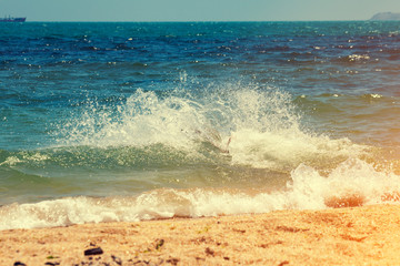 Sandy beach with yellow sand and sea