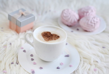 Cappuccino with heart pattern of cinnamon