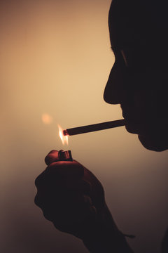 Woman lighting up a cigarette