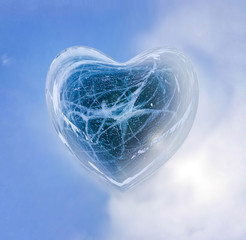 Blue Ice heart with bubbles and cracks isolate
