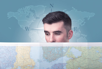 Young man holding map