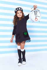 Beautiful cute pretty little girl baby blond curly hair fun play