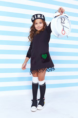 Beautiful cute pretty little girl baby blond curly hair fun play