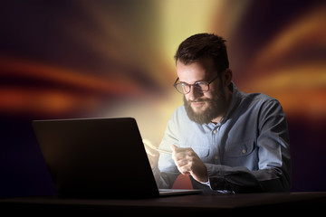 Businessman in the office at night