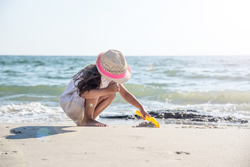 Happy little girl on the beach