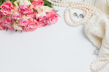 Female accessories with freah roses bouquet and copy space