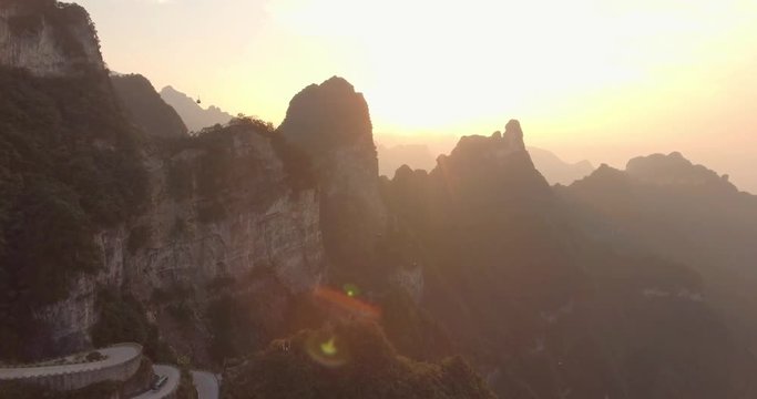 The long and windy 99 turn road going up to the summit of Tianmen shan in mountain national park, cableway and cable cars in Zhangjiajie, Hunan province, China.