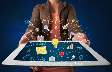 Woman holding tablet with applications