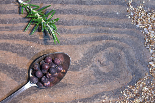 juniper berries on wooden table