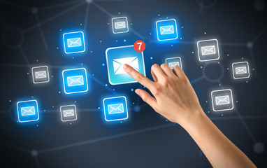 Hand touching mail icon
