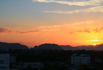 Sunset in sky beautiful colorful evening     with city silhouett