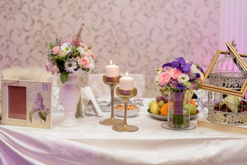 Arrangement for table with fruits, flowers and candles