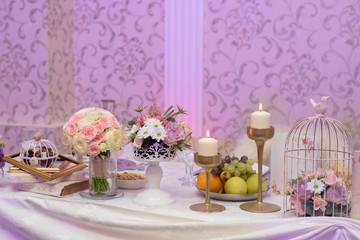 Arrangement for table with fruits, flowers and candles