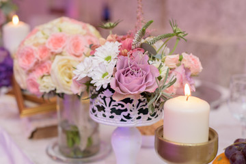 Arrangement for table with flowers and candles