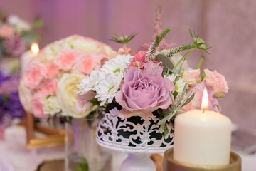 Arrangement for table with flowers and candles