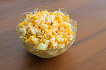 Festive salad with chicken breast, sweet corn, cheese and pineapple