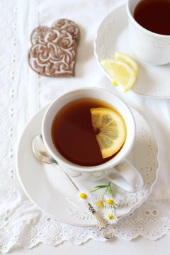 Cup of lemon tea and two gingerbread