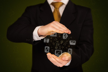 Businessman holding networking icons