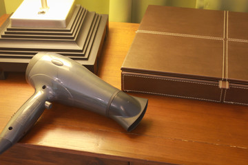 Table box, hairdryer in warm light