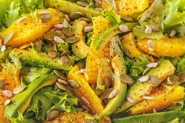 Avocado orange salad with  pumpkin  and sunflower seeds.