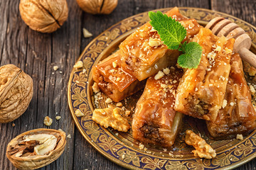 Traditional arabic dessert Baklava with honey and walnuts.