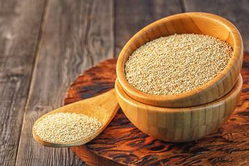White quinoa in a wooden bowl.