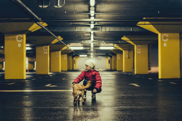 Girl with a dog in the public garage