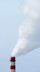 Smoke from factory chimneys pollutes the nature