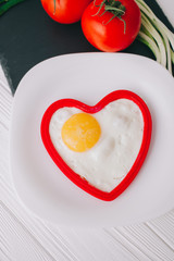 valentine day.romantic breakfast.fried egg and vegetables