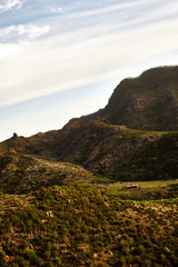 Amazing view of mountain peaks with beautiful clouds on the sunset. Location: Tenerife, Canary Islands, Spain. Artistic picture. Beauty world