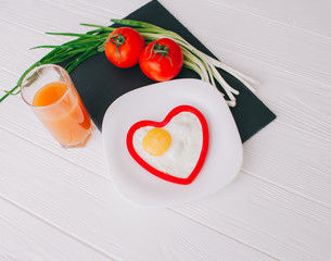 valentine day.romantic breakfast.fried egg and vegetables