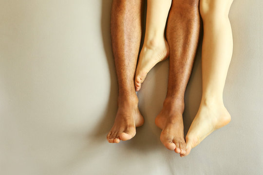Legs of couple in bed - Sleeping together