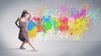 Fototapeta na wymiar Young colorful street dancer with paint splash