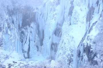 Plitvice lakes, World famous National park in Croatia, UNESCO world heritage, frozen waterfalls, cold winter scene