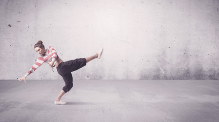 Pretty urban dancer with empty background