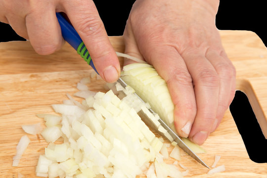 cook onion cut on a board on a black background