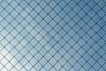 modern glass roof from inside with blue sky in the background